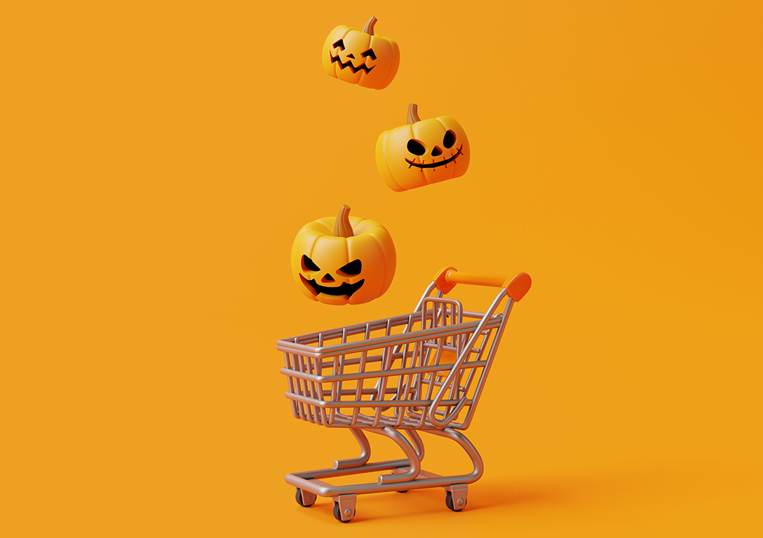 Shopping cart with scary looking pumpkins.